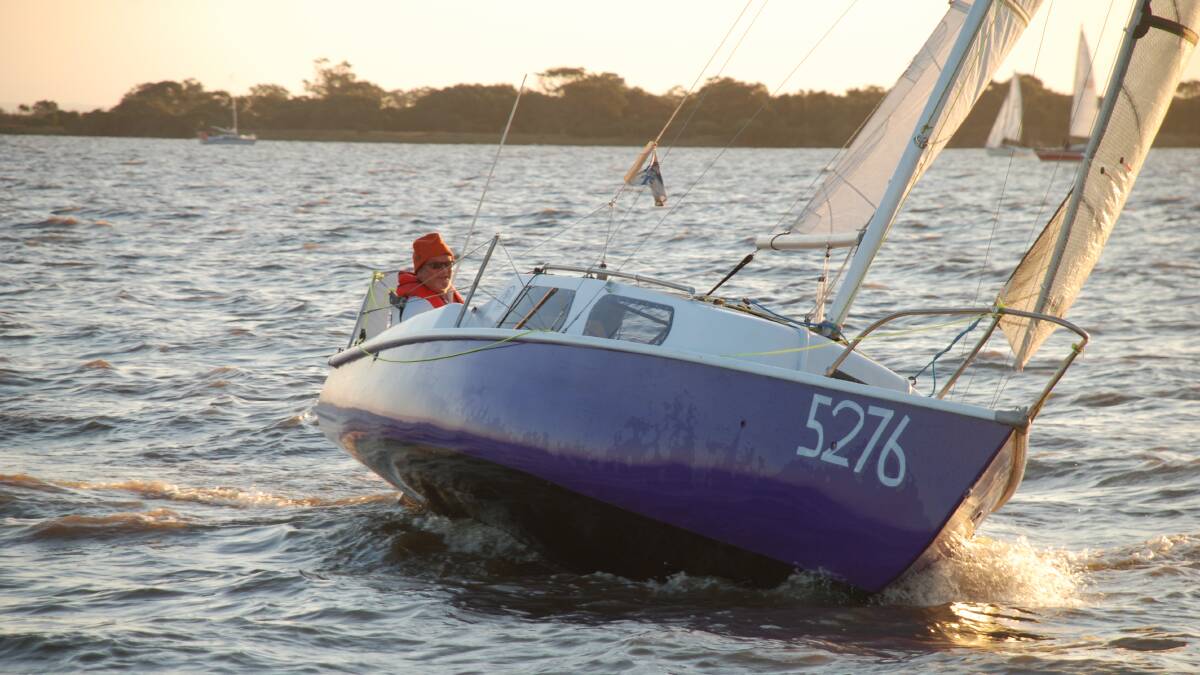 Peter Smith, from The Batemans Bay Sailing Club, guides Yaminji, his RL24, towards the start line on Lake Wellington.