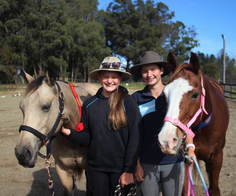 Chelsea and Madeline Nickson and their horses Marley and Tiger