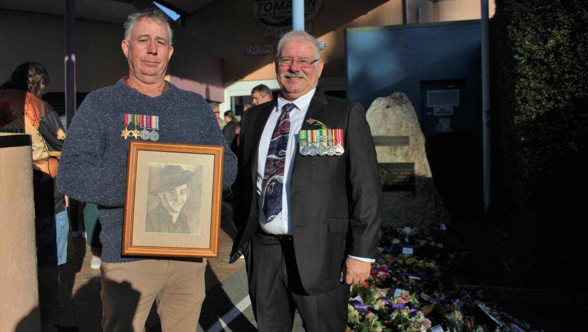 Tomakin's Mark Minehan (left) and Brian Calnan (right) are neighbours who attended the Anzac Day service together to support each other.
"There was a big crowd. It was as good today as it was 15 years ago," Mr Minehan said. He marched for his father - a WWII veteran.