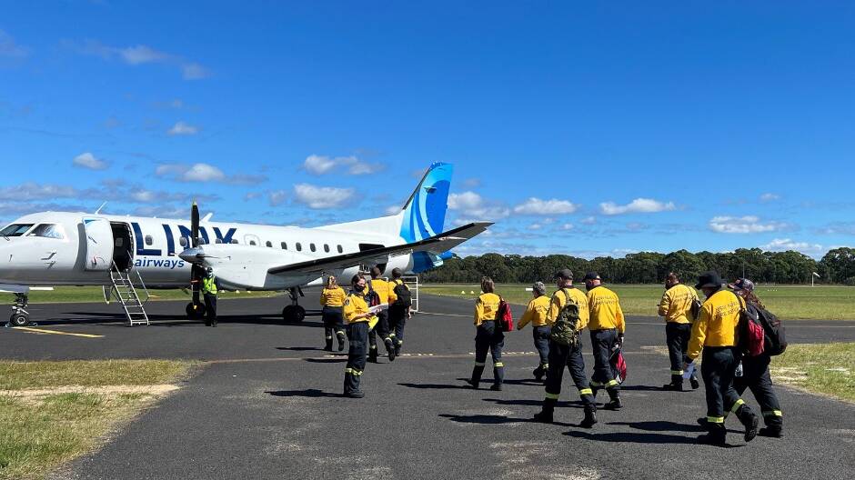 RFS Volunteers boarding a plane at Moruya Airport heading to Lismore
Photo: NSW RFS