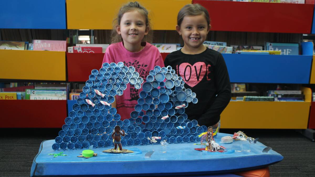 Local artists Eve Popelier-Knight and Anne Smith with their artwork 'Ocean Wave' at Batemans Bay Library
Picture: James Tugwell