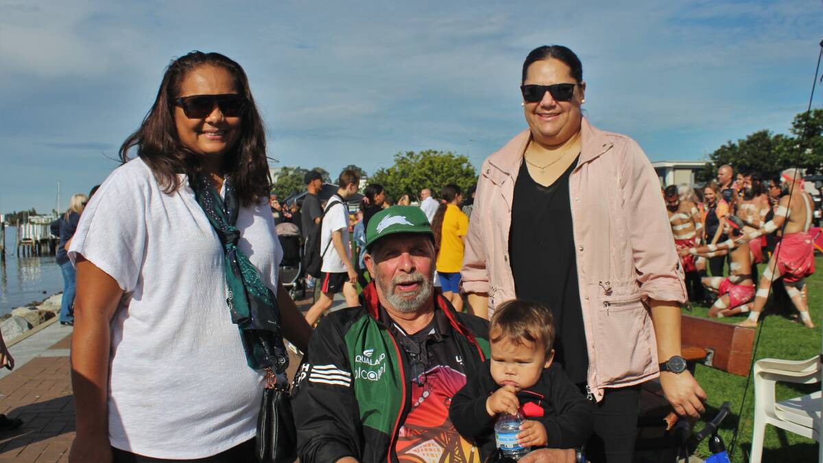 Three generations of one local Indigenous family: Melissa Ellis, left, her sister Cherie Callaghan, right, with their father, Athol Callaghan, centre, holding his grandson Jaydan Ellis.