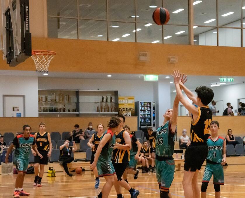 UNDEFEATED WEEKEND: #33 Marley Wilson defending a shot against the Shoalhaven Tigers Black. Photo: Shoalhaven Basketball Association. 