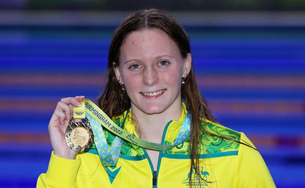 ALL SMILES: Jasmine Greenwood sporting her gold medal post swim in Birmingham. Picture: Clive Brunskill/Getty Images 