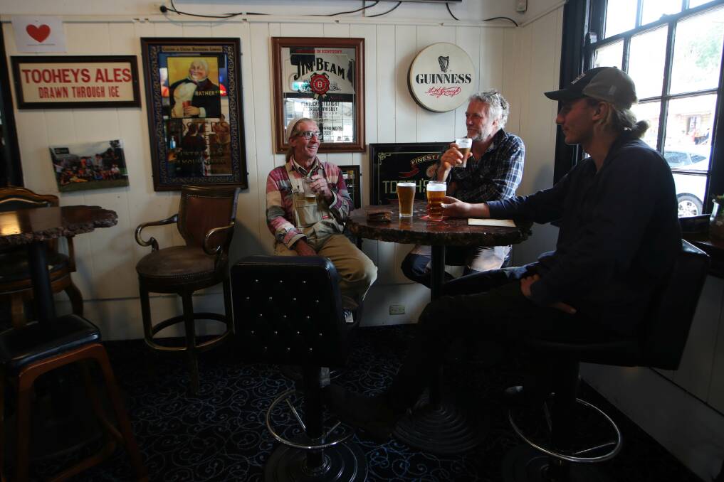 Coming together: Locals Peter Thomas, Darren Kelly and Jack Kenny at Kangaroo Valley Pub. Picture:Sylvia Liber