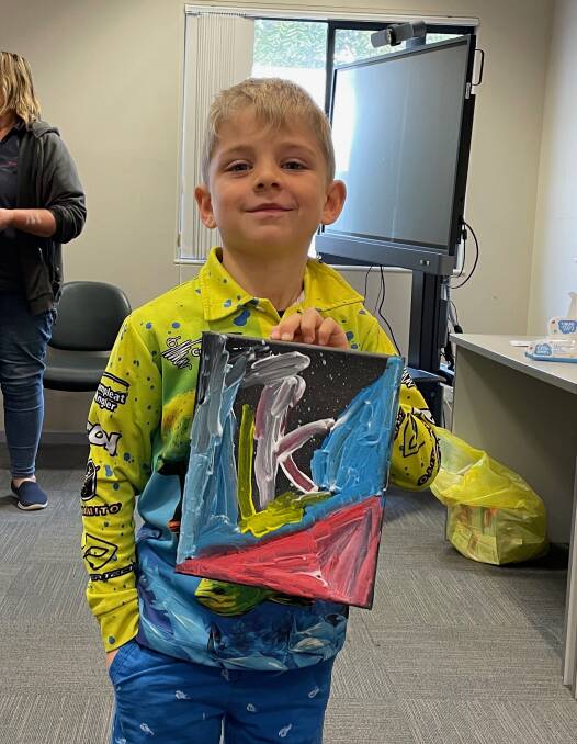 After dancing outside, the children did craft, including painting, at Narooma Library's NAIDOC cultural workshop on July 6. Picture by Marion Williams.