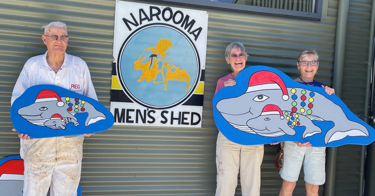 Reg and some of the elves who help make Narooma's Christmas whale decorations. This year there is a new look whale and calf design. Orders close November 17 so get in quick before stocks run out at the Narooma Community Men's Shed. Picture by Marion Williams