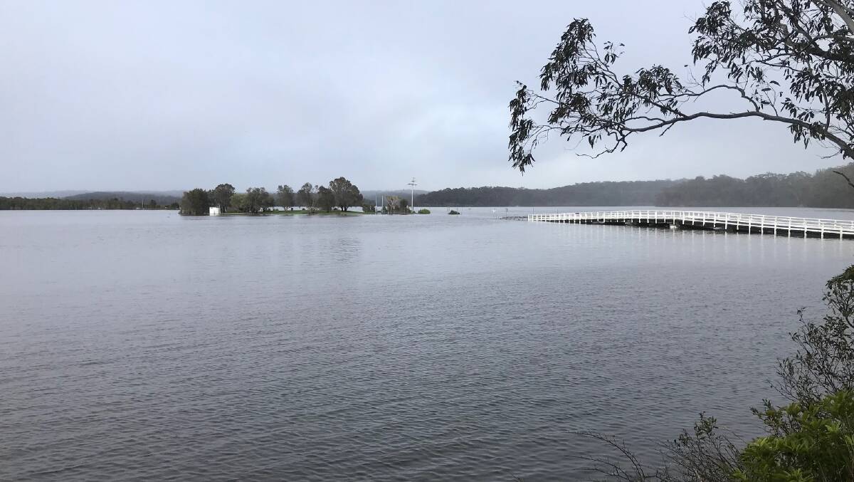 The causeway on the southern side of Wallaga Lake Bridge on Thursday, November 30, after heavy rain earlier in the week. Picture by Martin Oswin