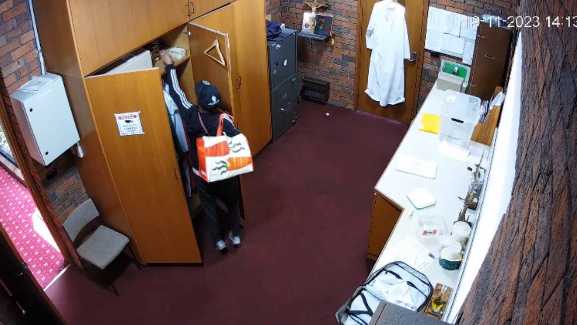 CCTV footage shows a woman allegedly searching through cupboards in a church. Picture supplied
