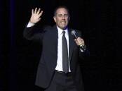 Jerry Seinfeld performing on stage. Photo by Greg Allen/Invision/AP