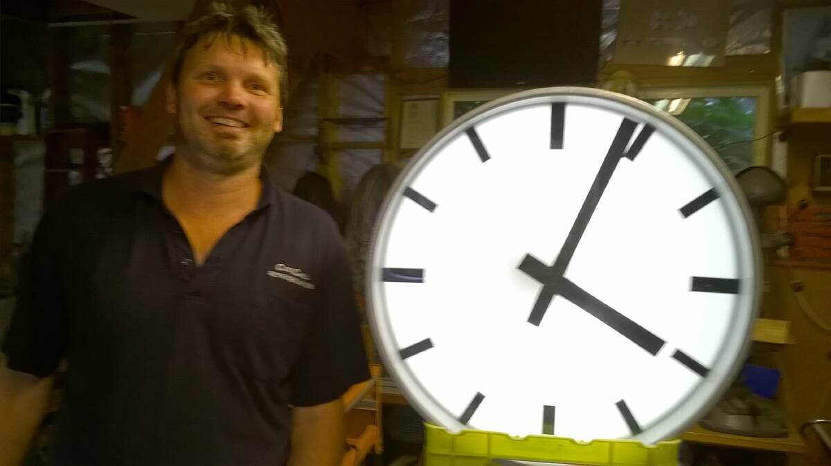 Batemans Bay Rotary member Wade Ashford repaired Batemans Bay's iconic clock. Picture supplied