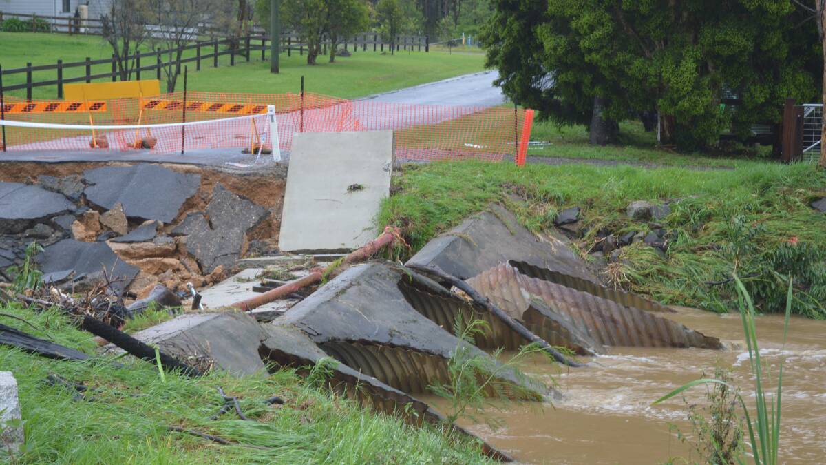 A flash flood on Wednesday, November 29 destroyed the Veitch Street bridge in Mogo on the South Coast, stranding at least 20 families on the street.