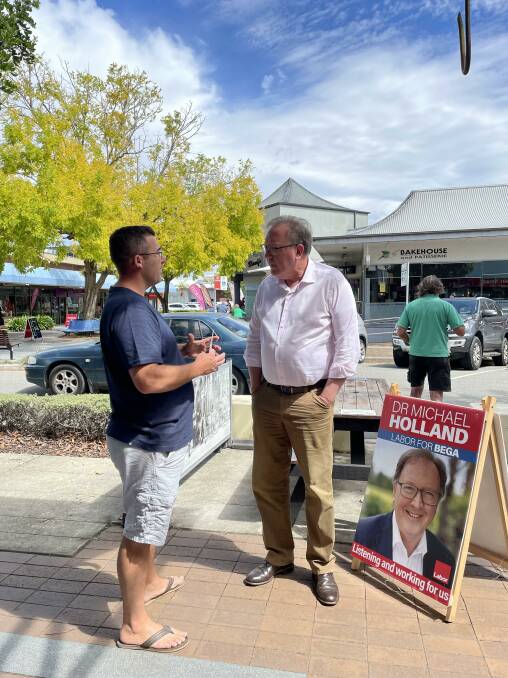 Dr Michael Holland speaks to a member of the public at Batemans Bay on March 8. Picture: Megan McClelland