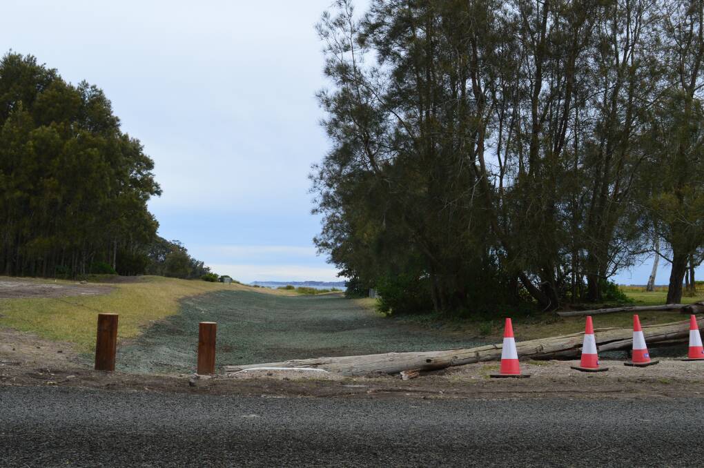 The 120-metre road has been barricaded off by witches' hats and telegraph pole, while soil and grass seed spray has been laid to revegetate the area. 