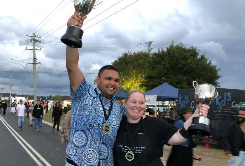 Champion oyster shuckers at the Narooma Oyster Festival 2023, Gerard 'Doody' Dennis and Sally McLean celebrate their wins. Picture by Marion Williams
