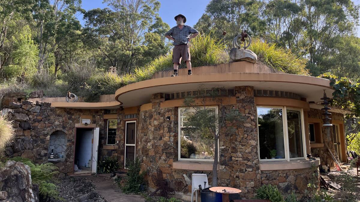 Don Firth stands on the roof of his property in Brogo. Picture by James Parker