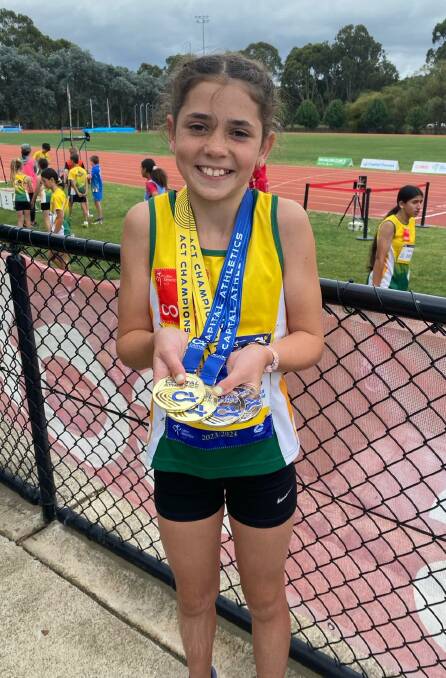 Rising athletics star Lacey Lee took home four medals at the Under 9 to Under 13 ACT Athletics Championships. Photo supplied.
