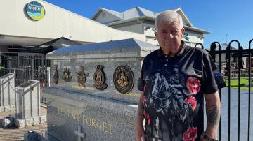 Paul next to the war memorial at Club Narooma. Photo Vic Silk