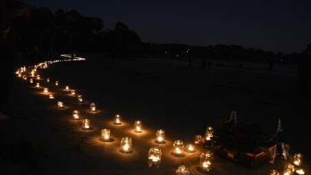 This year Dawn Simpson and her helpers will spell out Anzac with the candles. Photo Megan McClelland.