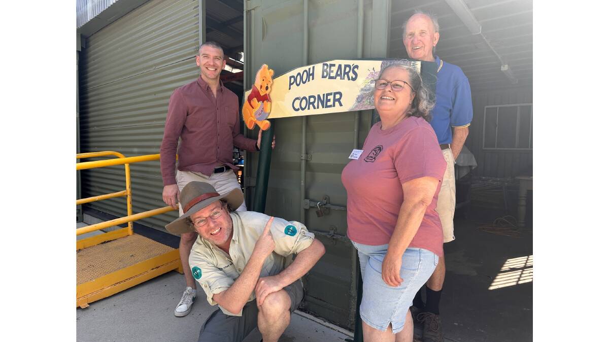 Mayor Mathew Hatcher, Tim the Yowie Man, artist Rose Gauslaa and Narooma Men's Shed member David Trickett with the new sign. Picture by Eurobodalla Shire Council 