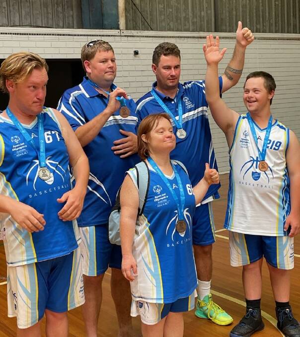 Special Olympics Australia (SOA) - South Coast basketball players Oscar Geeves, Laurie Masterson, Liz Godwin, Craig Mitchell, Josiah Bennett, with their medals. Picture supplied.