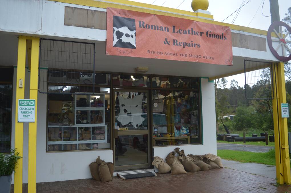 Mogo shop Roman Leather Goods, owned by Lorena Granados and Gaspar Roman, sandbagged and prepared for potential flooding. Picture by Megan McClelland