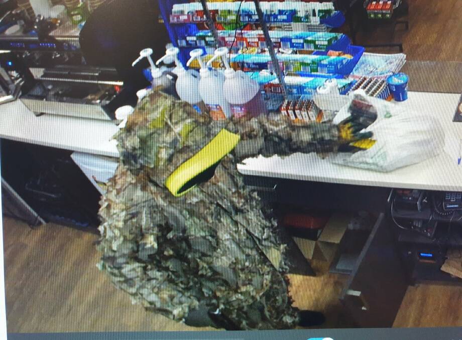 ARMED ROBBERY: Police say a man wearing this suit robbed a Mogo service station on Wednesday, September 11.