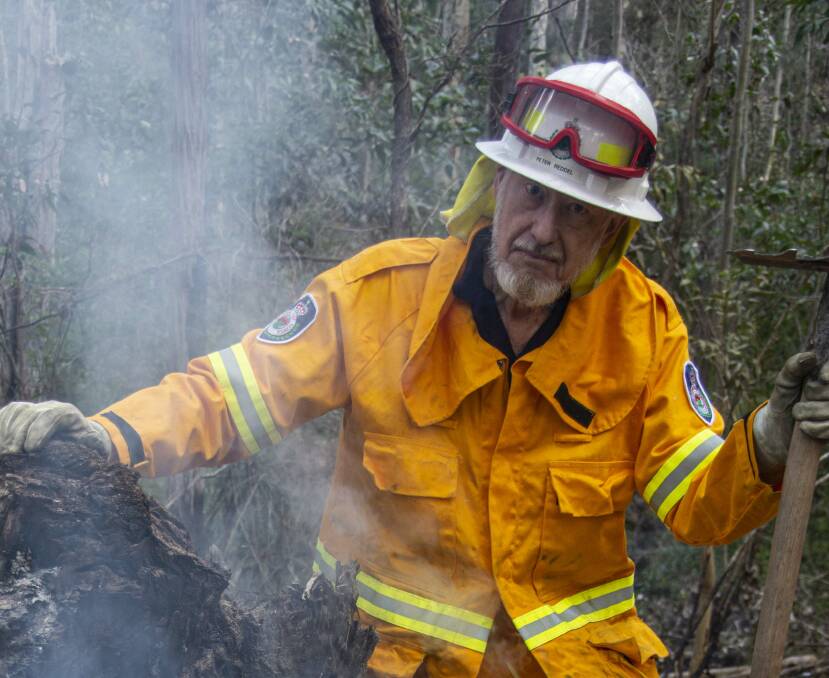 Peter Riddel and his Malua Bay RFS mate Dave Beare stood strong for north Mogo on New Year's Eve - then kept helping through that torrid summer, as Rob Geraghty's picture shows.