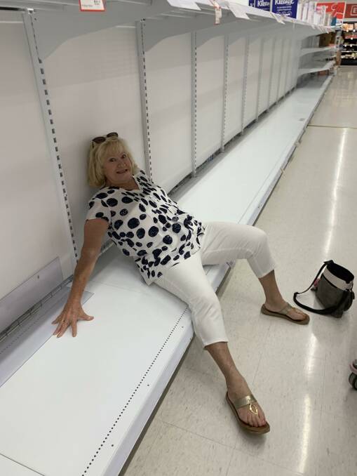 SORBENT SEATING: Our Gossip Gal Dawn Simpson turned the toilet paper shortage into a positive, sneaking a quick rest on deserted shelving.