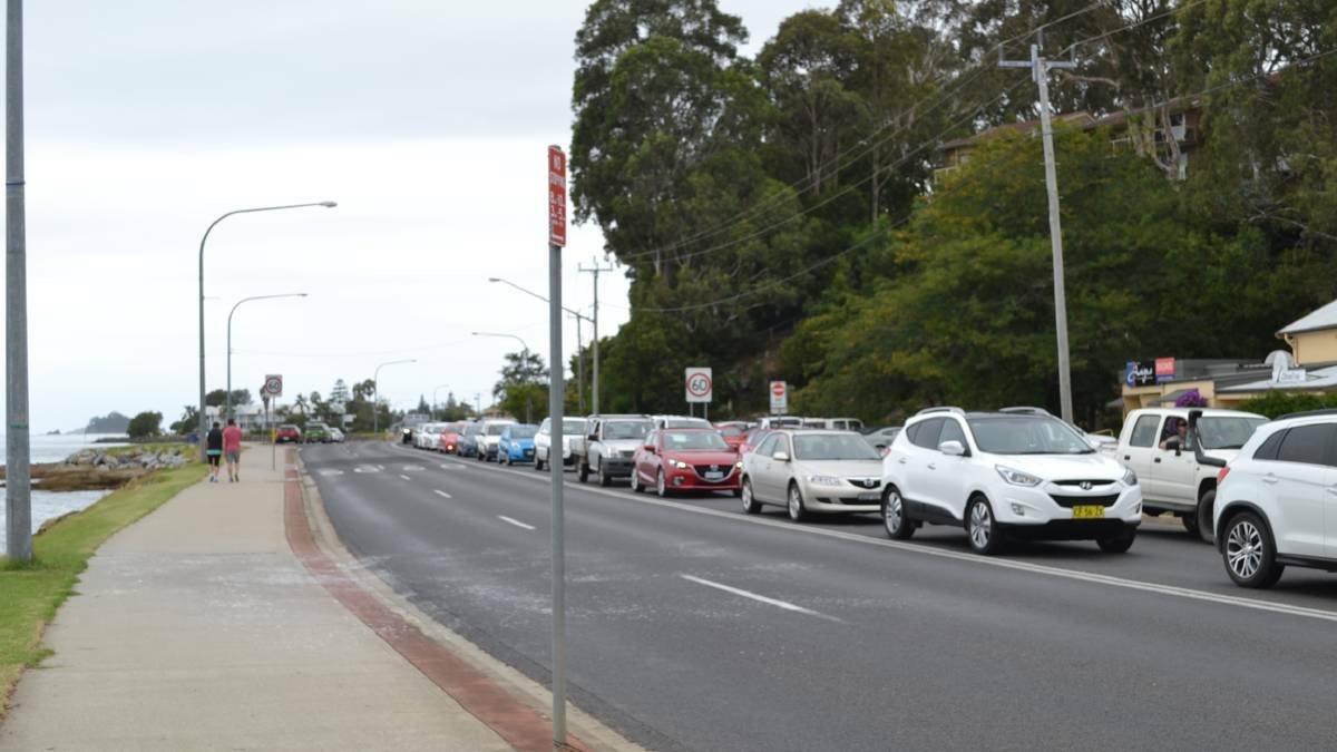 Heavy holiday traffic on Beach Road, Batemans Bay, on Easter Monday, 2016, as visiting motorists queue to reach the Princes Highway - where they would meet another gridlock on their return home.