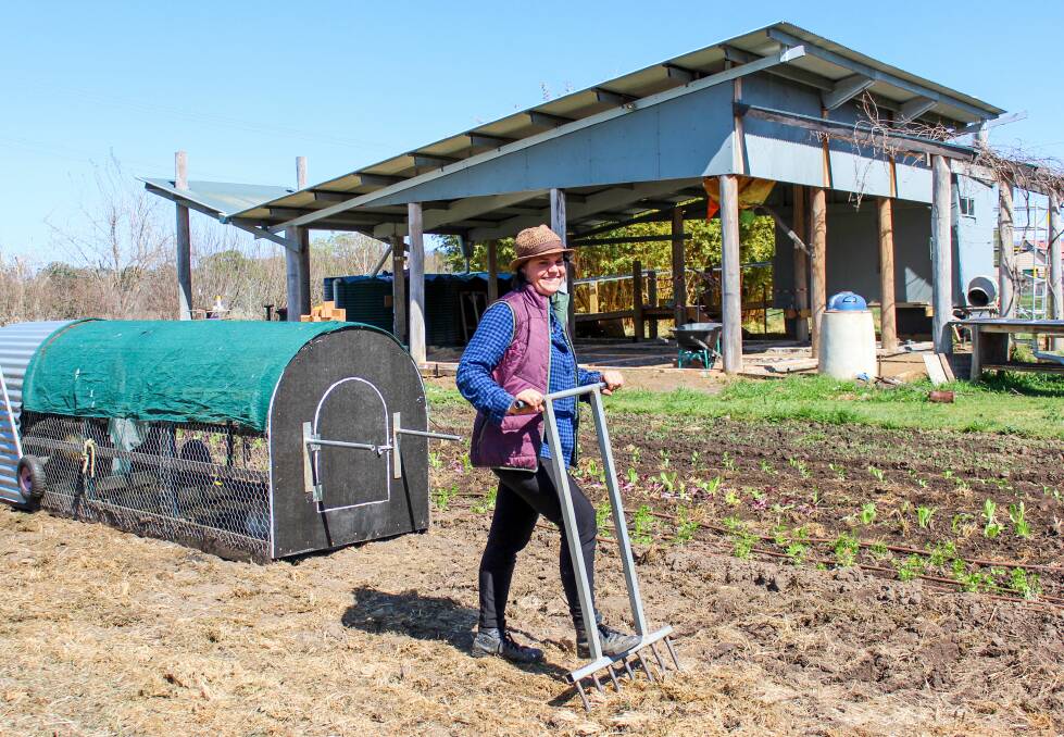 INTERN TURNS SOIL: SAGE's sixth market gardener intern Kylie Emmett gets on with Spring planting at the SAGE Garden in Moruya.