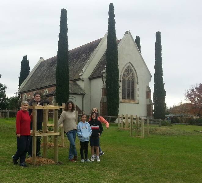 FREE FOOD FOR ALL: Anglican Parish Rector Linda Chapman, Anthony Mayne, SHASA president Kathryn Maxwell and garden-loving kids admire the new growth.