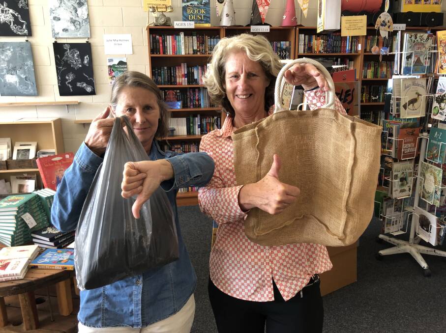IN THE BAG: Ms Manahan gives a thumbs-up to hessian, while retailer Janice Sagar gives plastic the thumbs-down.