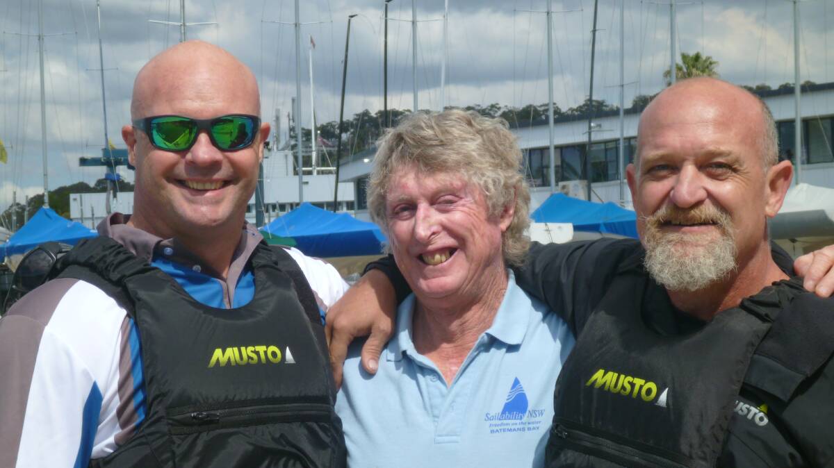 RIGGED AND READY: Sailability Batemans Bay’s training officer Michael Leydon (centre) with Invictus Games competitors Peter Arbuckle (left) and Davin “Bear” Brereton on Pittwater on Monday, September 17.
