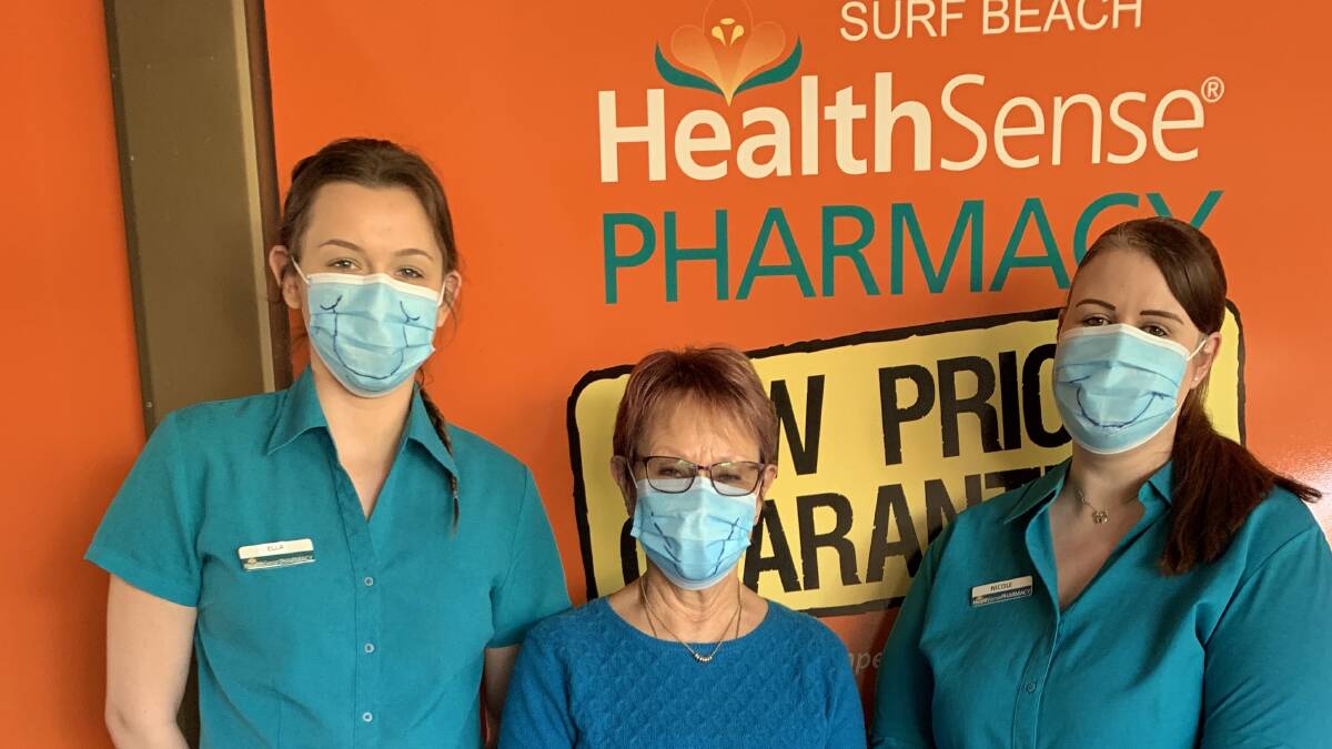 Fashionista: Staff at Surfbeach Pharmacy are doing their best to keep everyone's spirits high whilst masked with a big smile! Ella Pearce, Raija Johnston (a roped in customer!) and Nicole Evans.