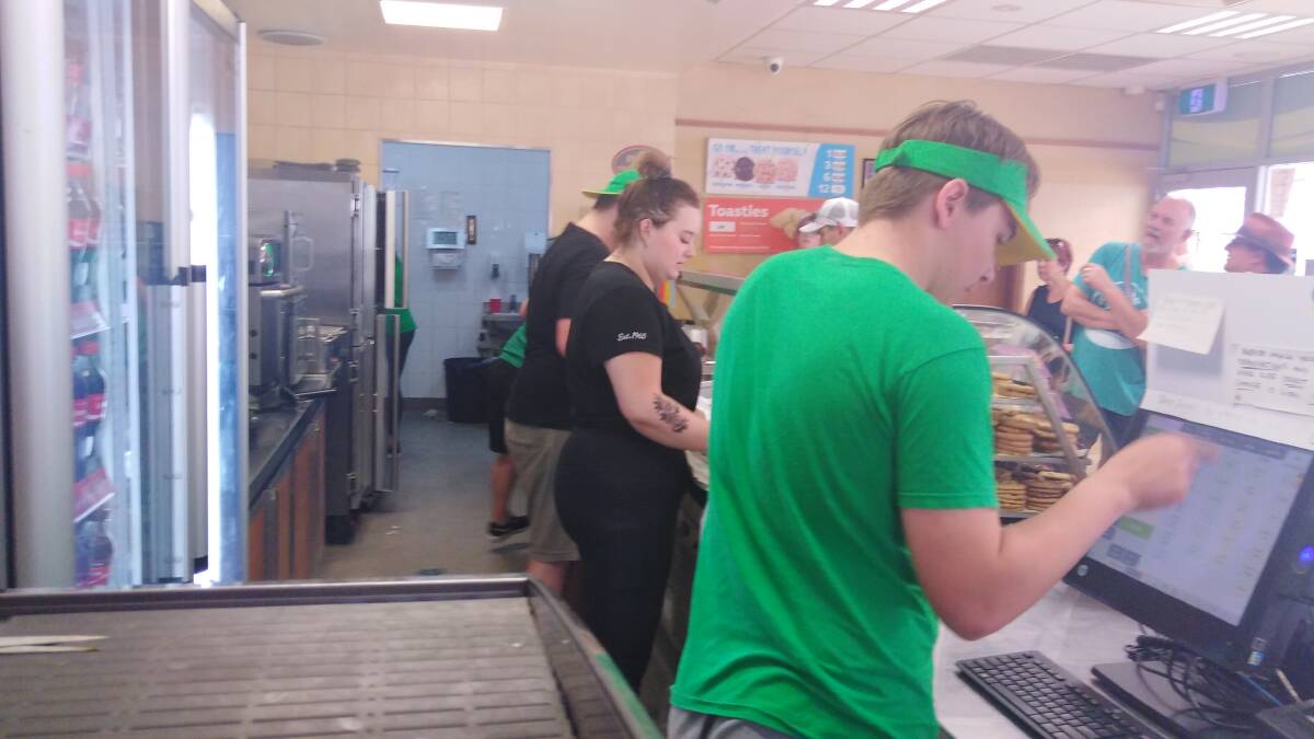 BUSY AS A NEW YORK SUBWAY: Batemans Bay Subway remained open to serve a long queue of customers after supermarkets closed with fire approaching.