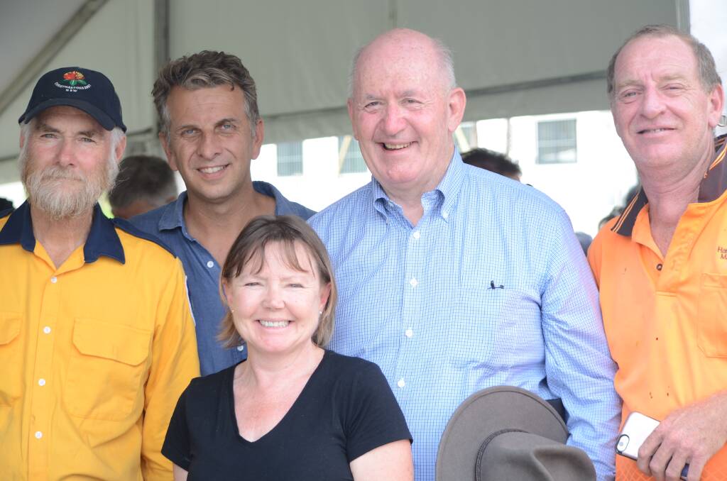 Mogo RFS Captain Frank Ziegler, Bega MP Andrew Constance, Sharyn Hanlon, Peter Cosgrove and Michael Hanlon at Mogo on Saturday. The Hanlons later shared their telecommunication woes with Mr Constance.