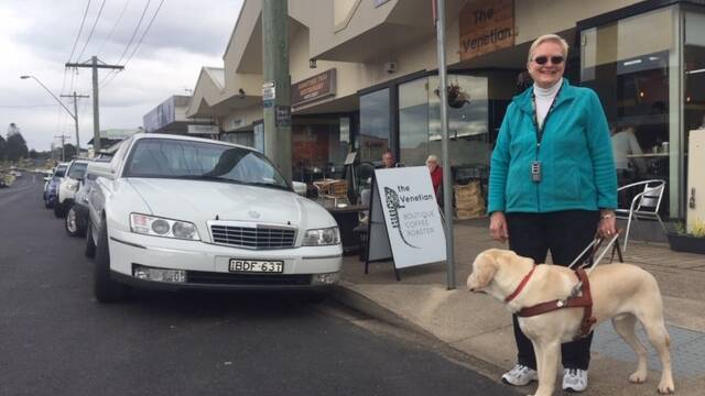 MR DARCY ON DUTY: Elaine Heskett relies on her guide dog, Mr Darcy, as her eyes and ears. Quiet electric and modern vehicles are a challenge.