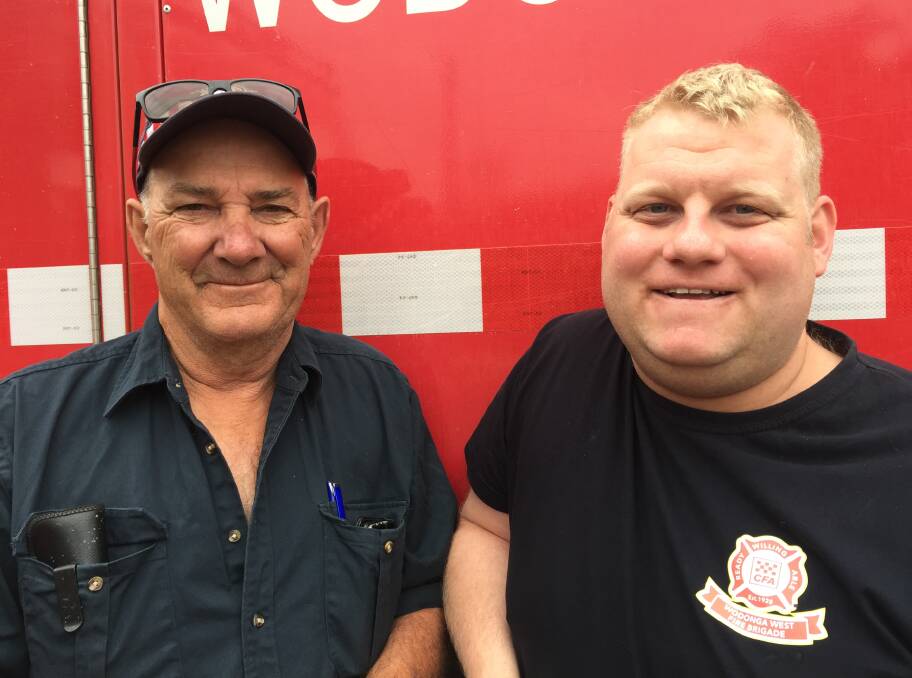 HEADING OUT: Victorian volunteers Brian Church and Kaleb Ryan ready for a day on the Currowan fireground on Wednesday, December 11.
