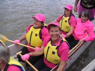 The late Becky Barney, dragon boating in Tasmania. Her partner Jude Rafferty established a scholarship in her memory to train McGrath Foundation Breast Cancer nurses.