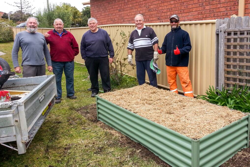 GROW YOUR OWN: Men's Shed volunteers Steve Ryder, Ken Parker, Greg Campbell, Leo Demchy and Wayne Brockman with one of their vegetable garden kits.