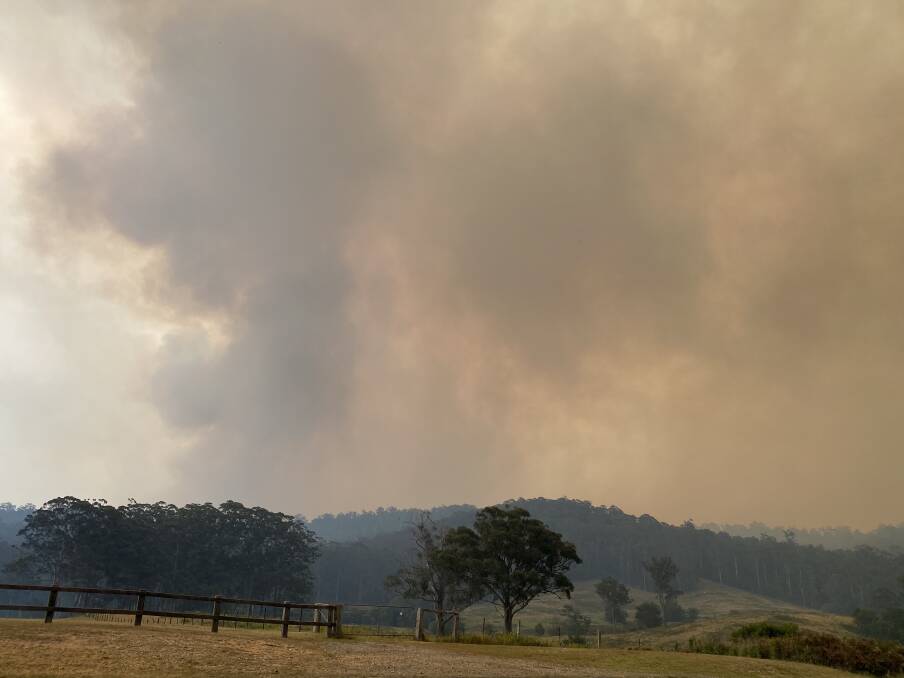 Smoke fills the sky on Sunday, December 1. Visibility remained too poor on Monday for fire crews to assess the Currowan fire, which jumped across the Princes Highway into the Murramarang National Park overnight.