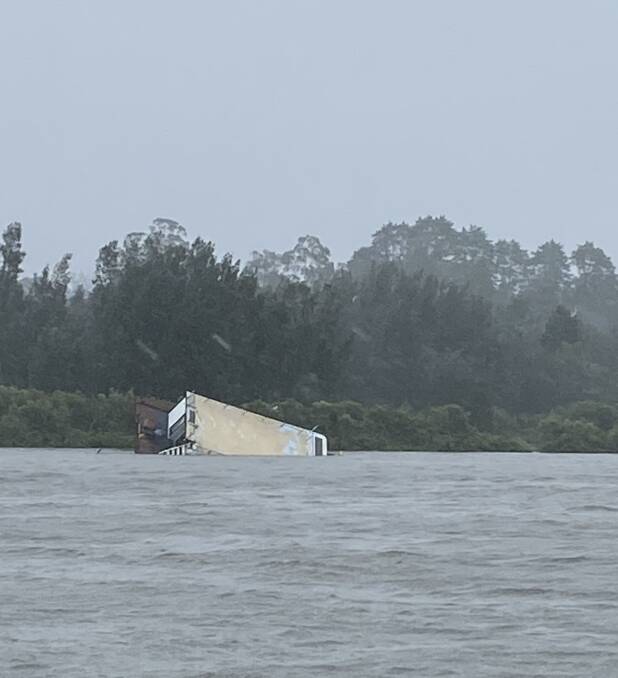 Stephanie Hunter's picture of a sinking houseboat on the Clyde River at Nelligen. Her mother saw it in trouble and alerted authorities to warn the owner on Monday, July 27.