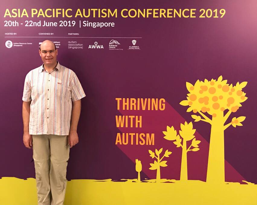 THRIVING: Batemans Bay librarian Andrew Radford is sharing his autism journey with the world at a conference in Singapore.