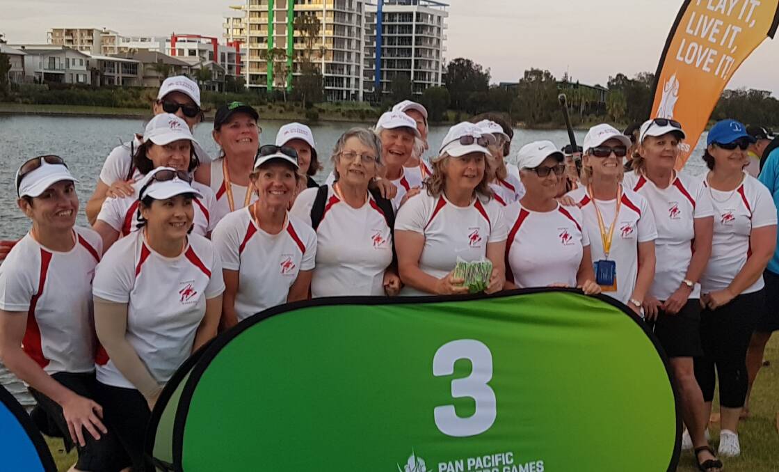 ON FIRE: The dragon boat paddlers from Nature Coast at the PanPacs Masters Games on the Gold Coast.
