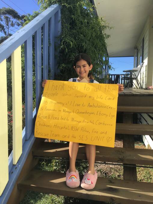 BIG SIGN, BIG THANKS: Celine Keady with her sign thanking everyone who helped her after a crash at Broulee on election day, May 18.