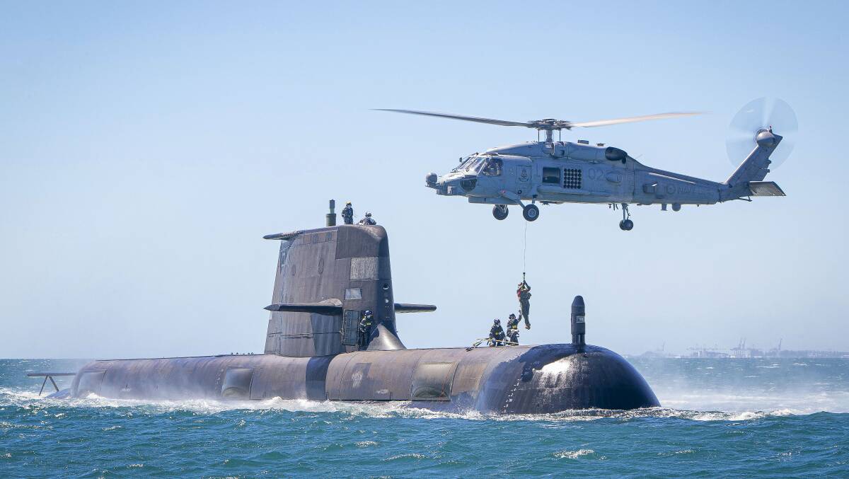 A Collins Class submarine. Australia's defence spending is growing but the government has budgeted for fewer civilian staff this year. Picture: Department of Defence.