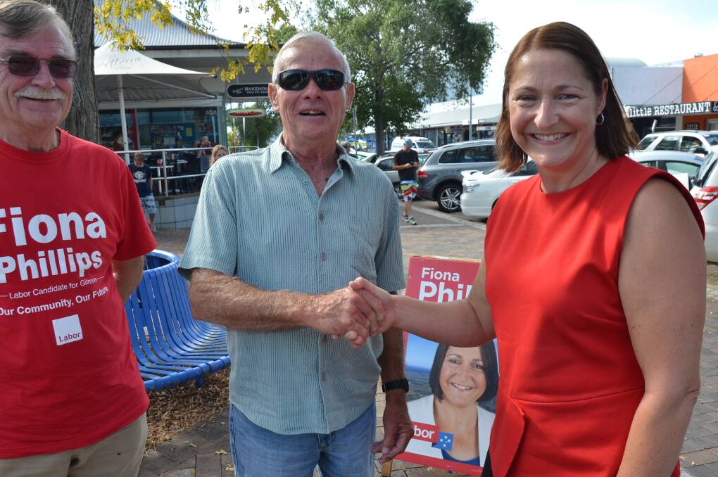 IN TOWN: Gilmore Labor candidate Fiona Phillips with volunteer Terry Whitney and Moruya supporter Alan Chegwiddef in Orient Street Batemans Bay on Thursday.  