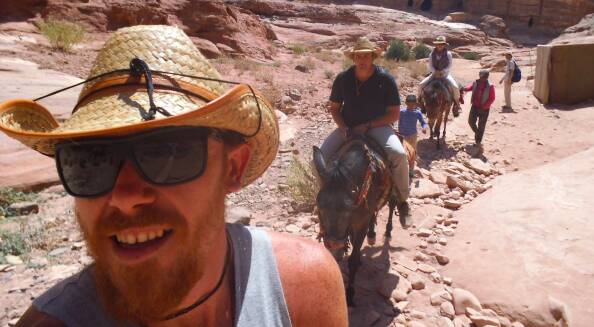 Stabbing victim Andrew Drake riding a mule in Jordan.