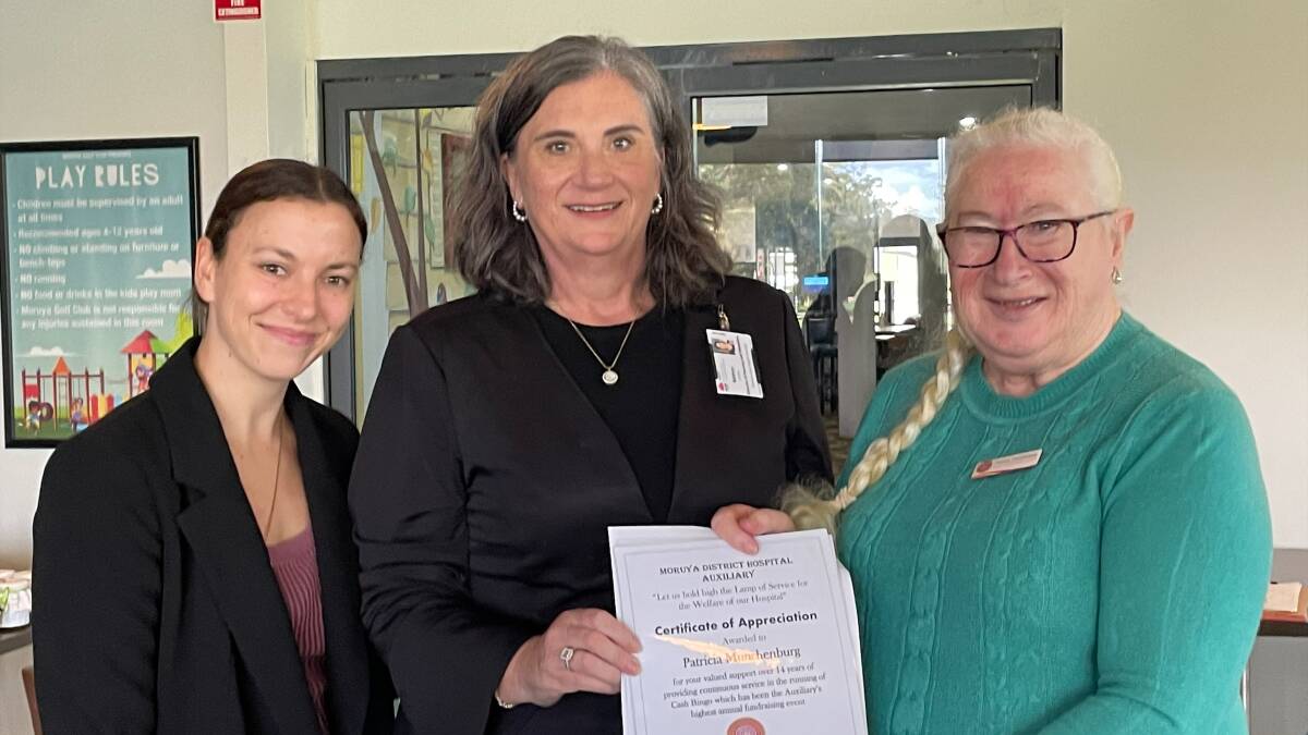 Patricia Munchenburg (right) is presented with her certificate by Moruya Hospital's Kathryn Lyons and Marie Moore. Picture supplied